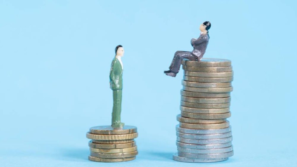 A photographic illustration showing two men standing on stacks of coins.