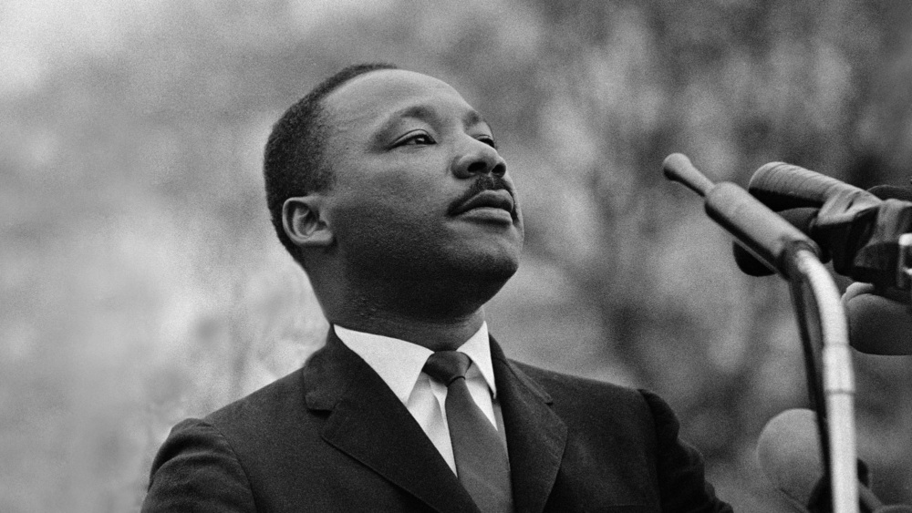 A photograph of Rev. Martin Luther King, Jr. speaking.